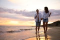 Lovely couple with glasses of wine on beach Royalty Free Stock Photo