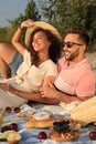 Lovely couple having picnic outdoors on sunny day Royalty Free Stock Photo