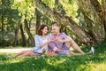 Lovely couple having a pleasant time eating fruits in the park