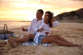 Lovely couple having romantic picnic on beach Royalty Free Stock Photo