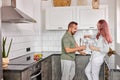 Lovely couple at home in the kitchen, enjoying spending time together Royalty Free Stock Photo