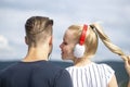 Lovely couple listening music. Relaxing outdoors together. Relationships concept. Royalty Free Stock Photo