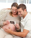 Lovely couple looking at an echography Royalty Free Stock Photo