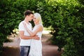 The lovely couple in love sitting on green grass. Royalty Free Stock Photo