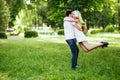 The lovely couple in love sitting on green grass. Royalty Free Stock Photo
