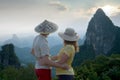 Lovely couple at sunset on top of the Chinese mountain of Moon Hill