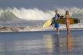 Lovely couple with surfboards on beach. Royalty Free Stock Photo