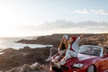 Lovely couple traveling by car near the ocean Royalty Free Stock Photo