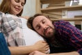 Lovely cute couple, young dad-to-be leaning gently on the belly of his cute pregnant wife, enjoying the expectation of the baby Royalty Free Stock Photo