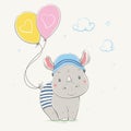 Lovely cute rhino stands with the yellow and pink balloons with hearts. Young dressed rhino in the children`s summer hat and the Royalty Free Stock Photo