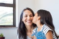 Lovely daughter kissing mother Royalty Free Stock Photo