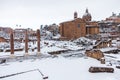 A lovely day of snow in Rome, Italy, 26th February 2018: a beautiful view of snowy Roman Forums and Church of the Saints Luca and Royalty Free Stock Photo