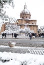 A lovely day of snow in Rome, Italy, 26th February 2018: a beautiful view of snowy Roman Forums and Church of the Saints Luca and