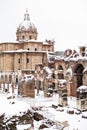 A lovely day of snow in Rome, Italy, 26th February 2018: a beautiful view of snowy Roman Forums and Church of the Saints Luca and Royalty Free Stock Photo