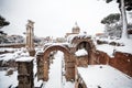 A lovely day of snow in Rome, Italy, 26th February 2018: a beautiful view of snowy Roman Forums and Church of the Saints Luca and Royalty Free Stock Photo