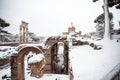 A lovely day of snow in Rome, Italy, 26th February 2018: a beautiful view of snowy Roman Forums and Church of the Saints Luca and Royalty Free Stock Photo