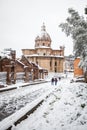 A lovely day of snow in Rome, Italy, 26th February 2018: a beautiful view of snowy Roman Forums and Church of the Saints Luca and Royalty Free Stock Photo