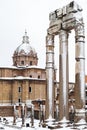 A lovely day of snow in Rome, Italy, 26th February 2018: a beautiful view of snowy Roman Forums and Church of the Saints Luca and Royalty Free Stock Photo