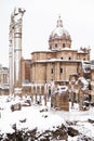 A lovely day of snow in Rome, Italy, 26th February 2018: a beautiful view of snowy Roman Forums and Church of the Saints Luca and Royalty Free Stock Photo