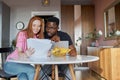 Lovely diverse man and woman check documents