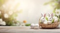 Lovely Easter fluffy bunnies in a wicker basket with colorful Easter eggs
