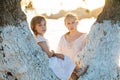 Lovely family. Cheerful girls outdoors portrait