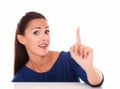 Lovely female with finger pointing up Royalty Free Stock Photo