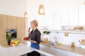 Lovely female posing and smiling at camera with plate of ripe st Royalty Free Stock Photo