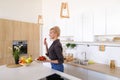 Lovely female posing and smiling at camera with plate of ripe st Royalty Free Stock Photo