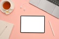 Lovely feminine workspace office desk top view with tablet mockup on pink background