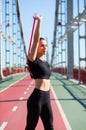 Lovely fit girl doing training with rubber resistance band on a Royalty Free Stock Photo