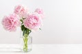 Lovely flowers in glass vase. Beautiful bouquet of pink peonies. Floral composition, copy space. Wallpaper, greeting card, poster