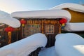 The lovely folk house with white snow