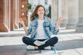 Lovely girl asks for a good grade in the exam. Girl prays in lotus position