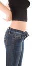 Lovely girl in blue jeans undress the shirt Royalty Free Stock Photo