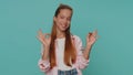 Lovely girl child looking approvingly at camera showing ok gesture, like sign positive, approve good Royalty Free Stock Photo