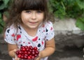 Lovely girl with fresh berries cherries in the garden. Royalty Free Stock Photo