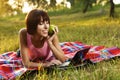 Lovely girl with laptop on picnic Royalty Free Stock Photo