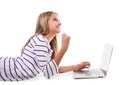 Lovely girl laying on the floor using laptop and celebrating victory,isolated Royalty Free Stock Photo