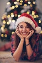 Girl with Santa Clause cap at Christmas eve Royalty Free Stock Photo