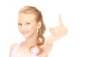 Lovely girl showing thumbs up sign Royalty Free Stock Photo