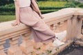 Lovely girl sitting over the bridge railing . Enjoying the beauty of the river. Sitting alone and looking at such a beauty arises Royalty Free Stock Photo