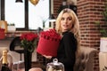 Lovely girlfriend holding valentines day red roses bouquet Royalty Free Stock Photo