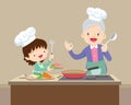 Lovely grandmother and child girl cooking in kitchen Royalty Free Stock Photo