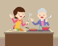 Lovely grandmother and woman cooking in kitchen okay gesture