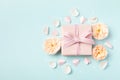 Lovely greeting card for Birthday, Woman or Mothers Day. Pink hearts, rose flowers and gift box on blue pastel table top view Royalty Free Stock Photo