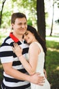 Lovely happy couple at a summer park. Royalty Free Stock Photo