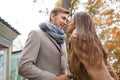 Lovely happy couple walking on the street together.