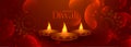 Lovely happy diwali banner with three diya lamps