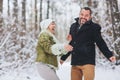 Lovely happy middle-aged family couple having fun outdoors in winter season together Royalty Free Stock Photo